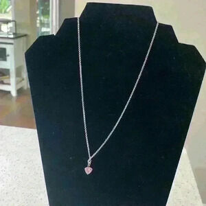 Necklace with a pink heart charm